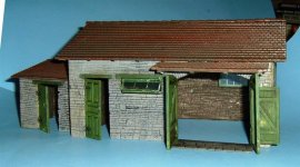 [Once in a diorama setting with a vehicle between the barn doors, hardly any interior will be seen.  If you want to show off the interior, I suggest blowing away a section of the roof and adding exposed wooden beams.   ]
