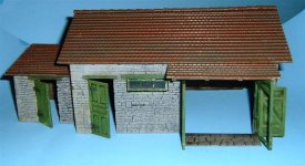 [Once in a diorama setting with a vehicle between the barn doors, hardly any interior will be seen.  If you want to show off the interior, I suggest blowing away a section of the roof and adding exposed wooden beams.   ]